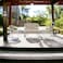 Light brown outdoor seating, 4 seater, glass table