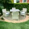 Light gray outdoor seating area, 4 seats with a glass table