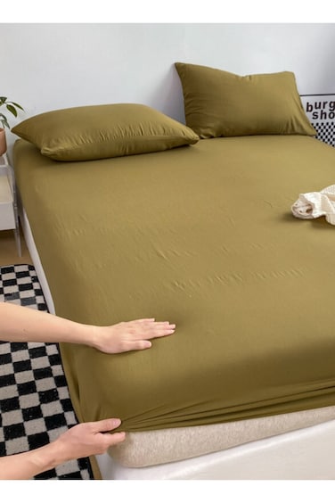 Home 3pc Set Includes a single-size fitted bedsheet and two pillowcases,washable cotton in a Khaki color.