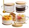 set of four vintage-style coffee mugs, each with a 15-ounce capacity. These thick-walled, coffee cup feature embossed patterns and come with bamboo lids and spoons. Perfect for serving oatmeal, yogurt, creative beverages, and iced coffee.