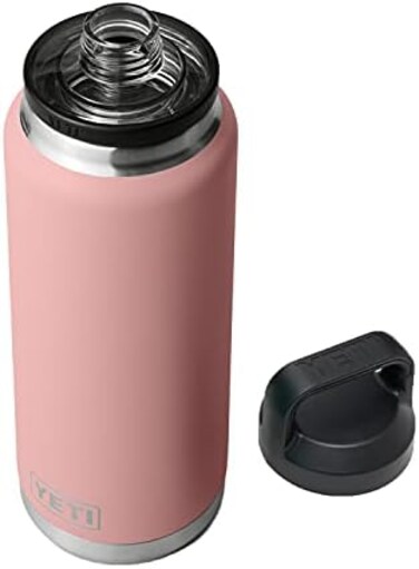 زجاجة YETI Rambler سعة 36 أونصة، معزولة بتفريغ الهواء، مصنوعة من الفولاذ المقاوم للصدأ مع غطاء للشرب السريع، لونها وردي رملي.