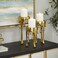 Deco 79 CosmoLiving by Cosmopolitan Aluminum Pillar Candle Holder with Dripping Melting Designed Legs, 12", 10", 8"H, Gold, SMALL SIZE, Set of 3
