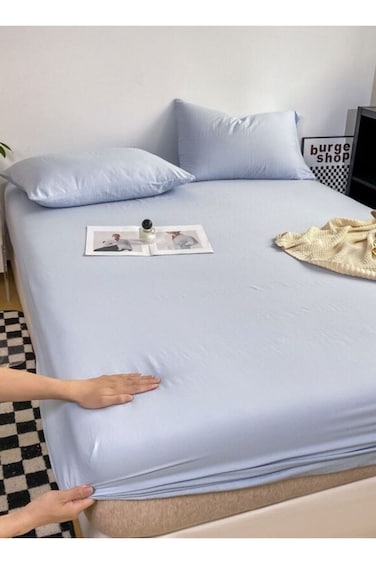 Home 3-Piece Includes a single-size fitted bedsheet and two pillowcases, washable cotton in a blue color.