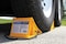 Camco 44472 Wheel Chock With Rope For Easy Removal Helps Keep Your Trailer or RV In Place Pack of 1 Yellow
