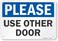 SmartSign - S-8182-PL-10 "Please - Use Other Door" Sign   7" x 10" Plastic Black/Blue on White