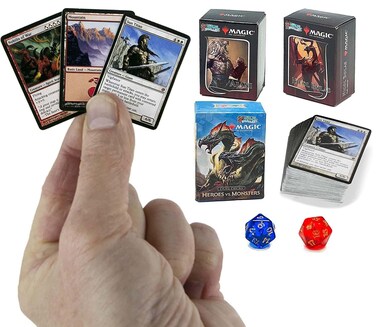 Worlds Smallest Magic: The Gathering Exclusive Collector Set Featuring Ajani VS. Nicol Bolas and Heroes VS. Monsters Duel Decks and Exclusive Playing Dice