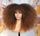 18Inch Long Curly Wig With Bangs for Black Women Afro Bomb Kinky Curly Wig Fluffy and Soft Synthetic Hair（Black to Brown）