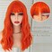 Orange Synthetic Wig with Bangs 16 Inch Shoulder Length Natural Wave Bob Wig for Women Curly Bangs Wigs Heat Resistant Glueless Costume Party Wig for Girls Tangle Free