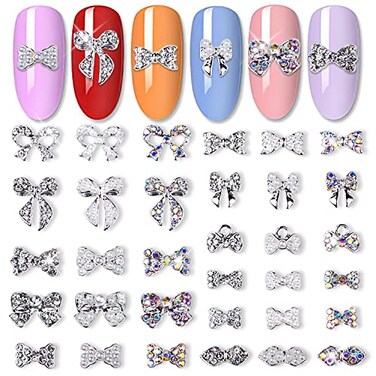 JERCLITY 33 Pieces Silver Alloy Bow Charms for Nails Bow Nail Charms Gems Bowknot Nail Studs Inlaid Pearl Clear Iridescent Rhinestone for Women Nail Art