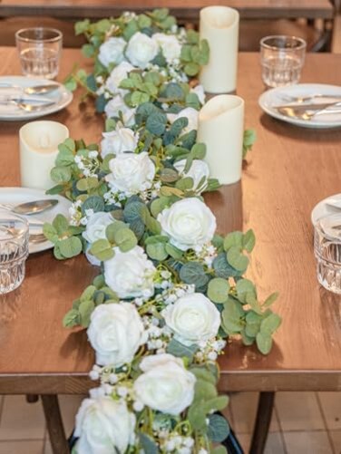 Pieshay 6FT Artificial Eucalyptus Garland with Flowers 10 White Roses Baby Breath Garland Floral Greenery for Wedding Party Centerpiece Table Runner Backdrop Wall Decor Decoration