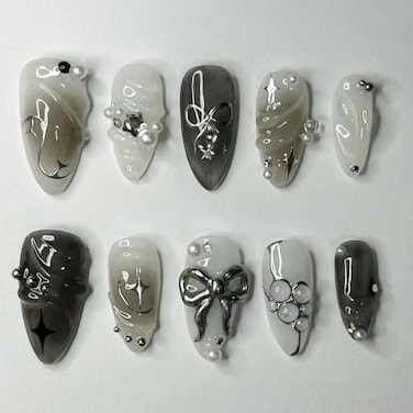 LBPEPAMZ Black Press on Nails Medium Almond Fake Nails with 3D Alloy Bow Pearl Designs Black Gradient Full Cover False Nail Water Drops Silver Star Glossy Acrylic Nails Stick on Nail for Women 24Pcs