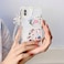 Shinymore Compatible with iPhone Xs CaseCute Clear Flowers Bear Camera Protector with Lovely Strap Bracelet Chain Girls Women Cover