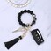 BAOSIWA Silicone Beaded Bracelet Keychain Black Flower Wristlet Key Ring Bangle Chains Gifts for Women Girls with Leather Tassel