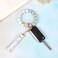 BAOSIWA Silicone Beaded Keychain Bracelet Wristlet Key Ring White Bangle Chains for Women with Leather Tassel
