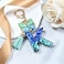 JINGUAZI Initial letter Keychains for Women Tassel Butterfly Pink Purple Cute Car Keychain for Wallet Backpack bag charm KBlue Green