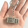 Auconda Lucky Silver Metal Dice Keychain with Black Dots Stylish and Fortunate Charm for Keys Bags and Everyday Use Durable Multipurpose Accessory