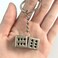 Auconda Lucky Silver Metal Dice Keychain with Black Dots Stylish and Fortunate Charm for Keys Bags and Everyday Use Durable Multipurpose Accessory