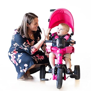 Joovy Tricycoo 41 Kids Tricycle with 4Stages Featuring ExtraWide Front Tire Removable and Adjustable Parent Handle Safety Harness MachineWashable Seat Pad and Retractable Canopy Pink