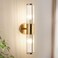 ECOBRT Modern Brushed Brass Vanity Light Fixture 1 Pack, Dual Glass Rods Wall Sconce for Bathroom, Double Light Socket E12 Candelabra Base, Mirror Vanity Lighting (Bulbs Not Included)