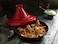 Staub Tajine 28cm Cherry 2L. High quality cast iron. Black matt enamel interior.Conical Ceramic Lid. Moroccan Cooking. Suitable for all hob types, incl. induction. Oversafe 260&deg; C. Made in France.