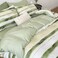LUNA Home-Single size, 4-piece, reversible duvet cover set featuring a striped design in a vibrant green color.