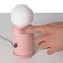 Wireless lamp and charger in pink with modern design, combines ambient lighting and convenient device charging for home d&eacute;cor spaces