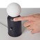 Wireless lamp and charger with modern design in black, combines lighting and device charging for home or office spaces, suitable for contemporary d&eacute;cor