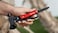 Green Lion Storm Breaker Multi-Tool Axe, 13 Functions, Needle-Nose Pliers, Wire Cutter, Hammer, Axe, Knife Blade, Saw, Phillips &amp; Slotted Screwdrivers, Fish Scaler, Red
