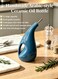 Arabic-style ceramic oil bottle, with a large capacity of 1 liter, heat-resistant and environmentally friendly oil pot, equipped with a stainless steel lid and anti-drip nozzle, featuring non-fading underglaze color, double-layer glaze with shading and UV protection functions, making it an eco-friendly edible oil container