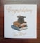 Congratulations - you did it! Cap and books