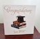 Congratulations - you did it! Cap and books
